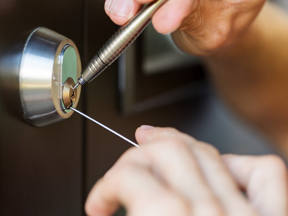 Technician opening a safe lock